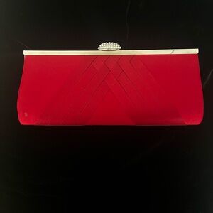 Red satin evening bag with detachable shoulder straps